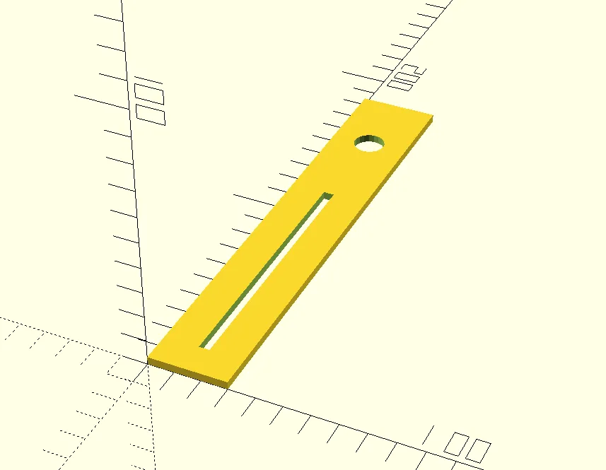 OpenSCAD preview of a yellow strip on a coordinate grid, with a round hole near one end and a long, narrow slot for a fader along the rest of it.